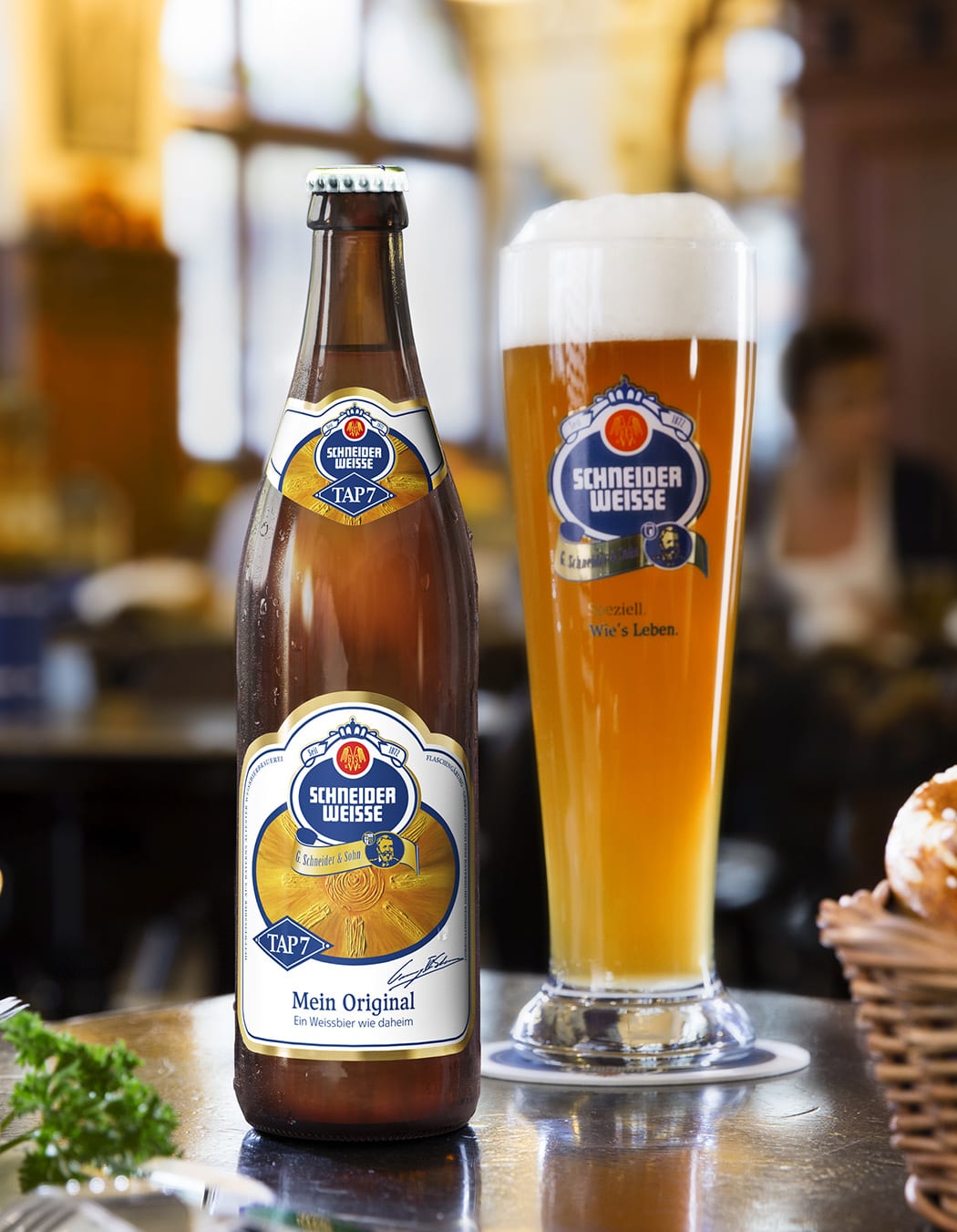 Schneider Weisse tap 7 beer bottle and pint glass.